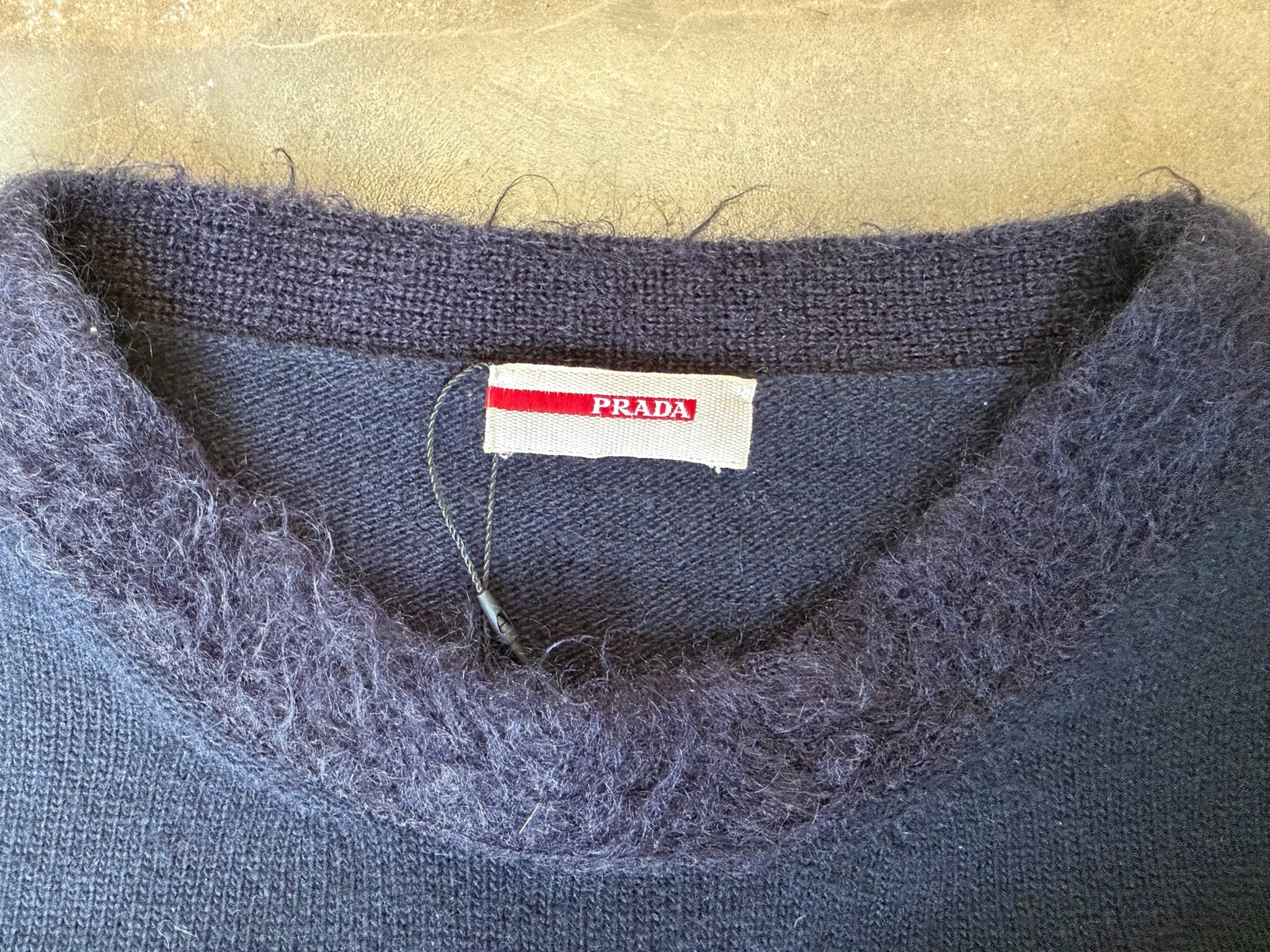 navy Prada top with mohair trimming